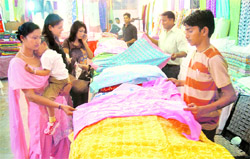 Customers check out the summer collection at Lajpat Rai Bhavan-15. 