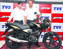 TVS Motor Company AGM- Marketing Arun Sidhharth poses on a newly launched TVS Jive motorcycle with Anshul Chopra, Area Manager, TVS Motor in Park Grand, Chandigarh.