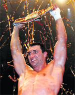 Wladimir Klitschko celebrates after winning IBF, WBO and IBO heavyweight boxing title match over Eddie Chambers in Duesseldorf, western Germany on Saturday.