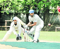 A batsman tries to sweep the ball during a match in the 3rd All-India Uttarakhand Cup in Dehradun on Monday. 