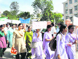 Students raising slogans in the rally organised on World Water Day at Hamirpur on Monday.