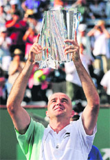 Ivan Ljubicic holds up his trophy after defeating Andy Roddick in the finals at the BNP Paribas Open tennis tournament on Sunday.
