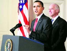 US President Barack Obama, joined by Vice-President Joe Biden, makes a statement to the nation after the final vote in the House of Representatives for overhaul of the health care system, in the White House in Washington on Sunday.  AP/PTI