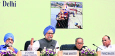 Prime Minister Manmohan Singh along with Finance Minister Pranab Mukherjee, Agricultural Minister Sharad Pawar and Deputy Chairman of Planning Commission Montek Singh Ahluwalia at a conference in New Delhi on Tuesday.