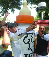 BJP members led by Vijay Goel protest outside the Chief Ministers residence in New Delhi on Tuesday.