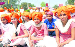 Girls wearing turbans attend a function at Khatkar Kalan to pay tributes to Shaheed Bhagat Singh