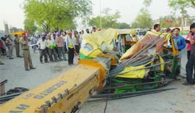 Restoration work under way after a mini-crane fell on an autorickshaw at a Metro construction site in Sarita Vihar, New Delhi