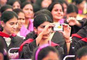 A student clicks pictures during convocation of Government PG College in Gurgaon