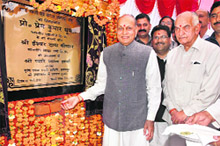 Chief Minister Prem Kumar Dhumal laying the foundation stone of a cattle feed farm and agriculture produce market at Jahu on Wednesday.