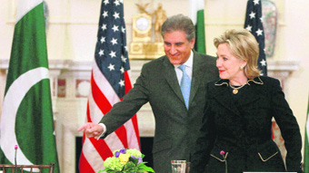 Secretary of State Hillary Rodham Clinton (right) and Pakistan Foreign Minister Shah Mehmood Qureshi take their seats during the opening session of the US-Pakistan strategic dialogue at the State Department in Washington on Wednesday.