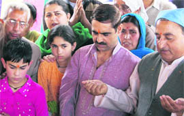 Devotees pray on the occasion of Ramanavami at Ramaji Mandir in Srinagar on Wednesday.