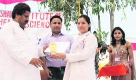 Minister for Revenue, Relief and Rehabilitation Raman Bhalla gives prizes to participants of a symposium on TB at the Paramedical Institute, Baba Budhan Shah Educational Trust, in Jammu on Wednesday.