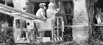 Fire brigade personnel looking for the cause of the fire at Stephen Court building in Kolkata on Wednesday.