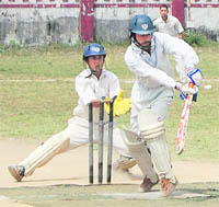 A batsman plays a shot during the Central Government Employees Welfare Coordination Committee (CGEWCC) Cricket Tournament in Dehradun on Thursday.