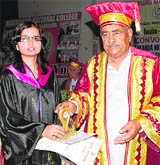 A student gets a degree during the convocation of Markanda National College, Shahabad, on Thursday.