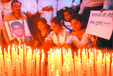 Parents and friends of Akshay Gupta gather for a candle march on his 18th birth anniversary in Jalandhar on Thursday.