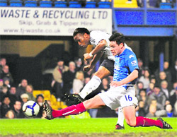 Chelseas Didier Drogba fights past Steve Finnan to score a goal against Portsmouth on Wednesday. 
