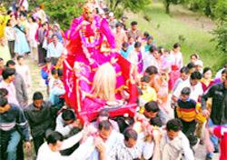 A dhami being in a procession during Chaitol festival in Pitthoragarh district on Friday.