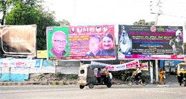 Hoardings put up on a road in Dehradun.