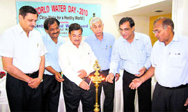 HP Uniyal, Director, Uttarakhand State Planning Commission, lights a lamp at a seminar in Dehradun on Friday.