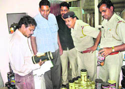 Officials conduct a raid on a fake drug manufacturing unit in Sirsa