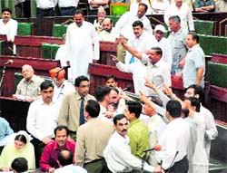 MLAs protest in the Assembly in Jammu on Friday. Tribune photo: Anand Sharma