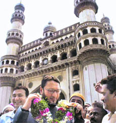 Muslim leader Asaduddin Owaisi being welcomed for leading the campaign to restore four per cent quota for the community, in Hyderabad on Friday.