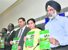 Minister of State for External Affairs Preneet Kaur releases a booklet on agriculture opportunities in Africa, in Chandigarh on Friday