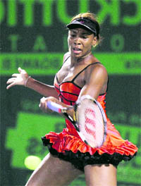 Venus Williams returns a shot to Sorana Cirstea during play at the Sony Ericsson Open in Key Biscayne, Florida, on Thursday. 