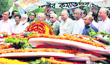 Veteran freedom fighters pay tributes at the memorial for war heroes to mark the Bangladeshs Independence Day in Saver, on the outskirts of Dhaka, on Friday.