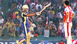 KKRs Manoj Tiwari acknowledges the crowd after reaching his half century at the PCA Stadium in Mohali on Saturday. Tribune photo: Pradeep Tewari