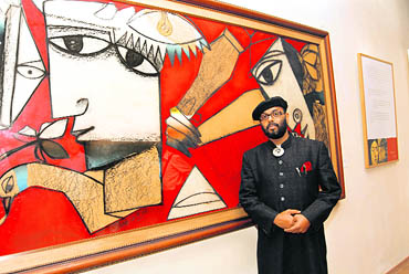Paresh Maity with one of his paintings at the Lalit Kala Akademi in New Delhi. The akademi recently hosted an exhibition spanning two decades of the artists work 