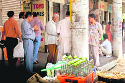 Banta bottles and cut fruit being sold openly outside a wine shop in Sector 22, Chandigarh.