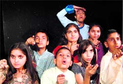 A scene from the play, Andher Nagri Chopat Raja, presented at the Natrang Studio Theatre in Jammu on Sunday. A Tribune photograph