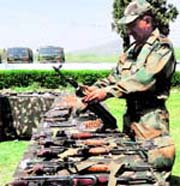 The Army on Sunday displays arms and ammunition recovered from militants killed in Kupwara district. Photo: Amin War