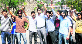 Students protest at Panjab University in Chandigarh on Monday.