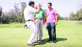 Course captain IPS Mann makes a point as golf icon Jeev Milkha Singh (extreme right) has a feel of the greens at the Chandigarh Golf Club on Monday.