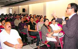 Rishab Nayar, a career counsellor, addresses a seminar in Dehradun on Sunday. 
