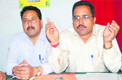 Surat Singh Negi, state president of the Pradhan Sangthan, addresses a press conference in Dehradun on Saturday.