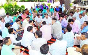 Doctors and other staff members of a hospital hold a protest in Karnal