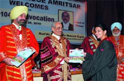 A girl gets her degree during a convocation at Khalsa College in Amritsar on Sunday. Photo: Vishal Kumar