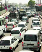 A traffic jam between Dogra Chowk and Tawi Bridge in Jammu on Monday. Tribune photo: Anand Sharma