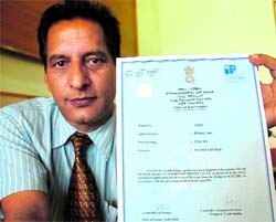 Pradeep Sharma shows a certificate issued by the Patent Office, Government of India, in Jammu.