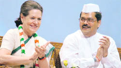 Congress president Sonia Gandhi and Union Minister of State Mukul Wasnik during the national covention of Congress Seva Dal in New Delhi on Monday.