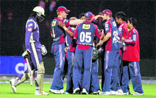 Delhi Daredevils players celebrates as KKRs Chris Gayle (L) returns after caught by Amit Mishra at Firozshah Kotla ground in New Delhi on Monday. 