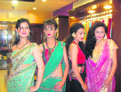 Young models showcase ethnic Indian and Indo-Western collection of Ajooni.