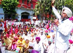 CPM activists demonstrate outside the Deputy Commissioner office in Amritsar on Tuesday. 