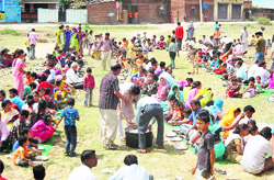Devotees being fed langar on the occasion of Hanuman Jayanti in Dehradun on Tuesday. 