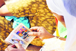 A woman reads the Shiva Chalisa