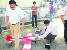 Students working on a model during NIMBUS, a festival organised for engineering students from various states, at the National Institute of Technology in Hamirpur.